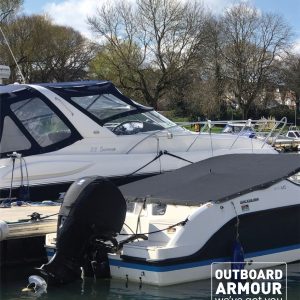 docked boats with an outboard cover on